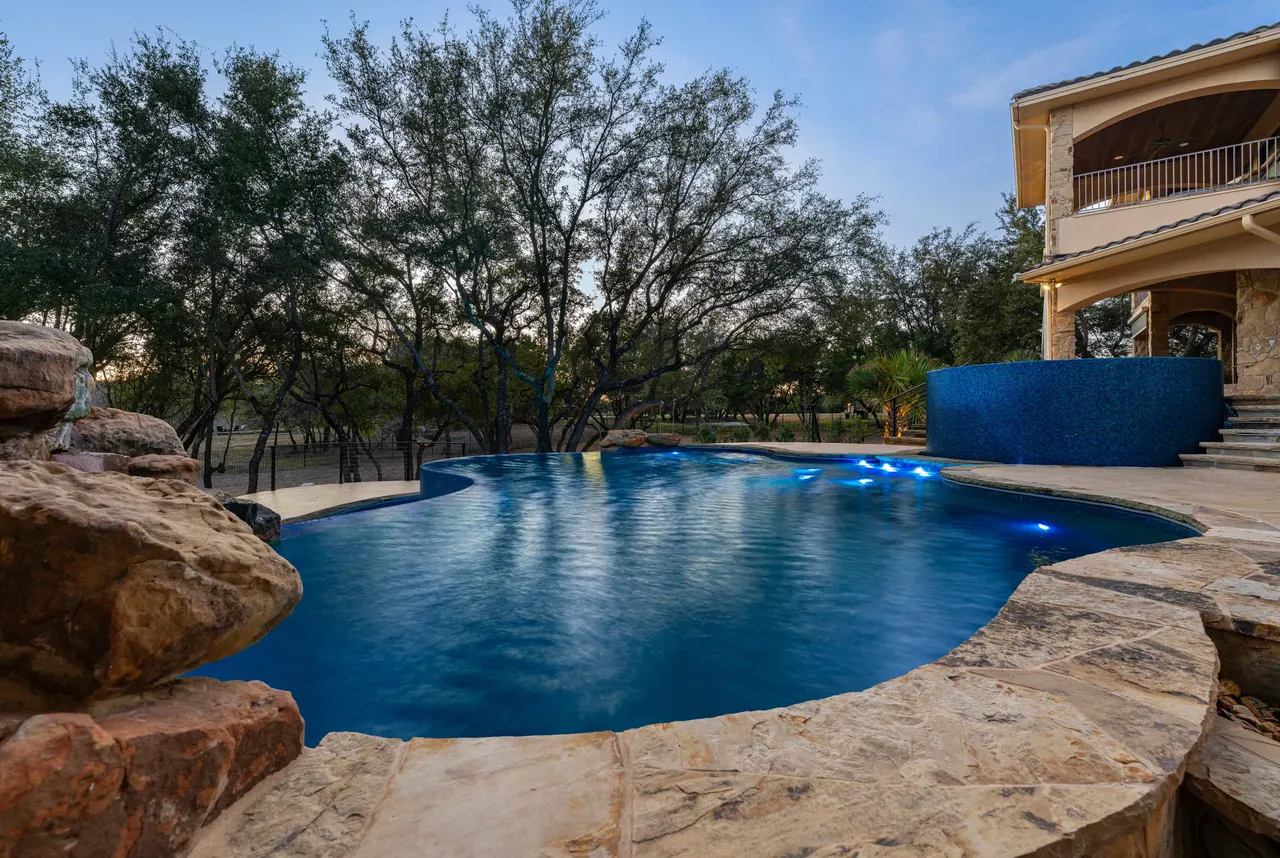 Boulder Slide — Family freeform pool in Tarrytown, TX by GB IV Designs (photo 5)
