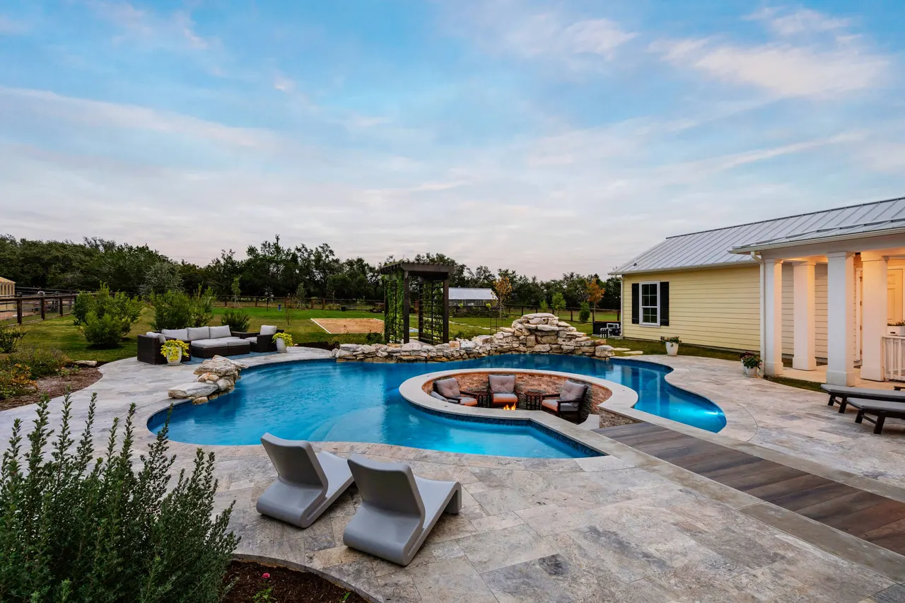 Farmhouse Lagoon — Freeform pool with sunken lounge in Travis County, TX by GB IV Designs (photo 5)