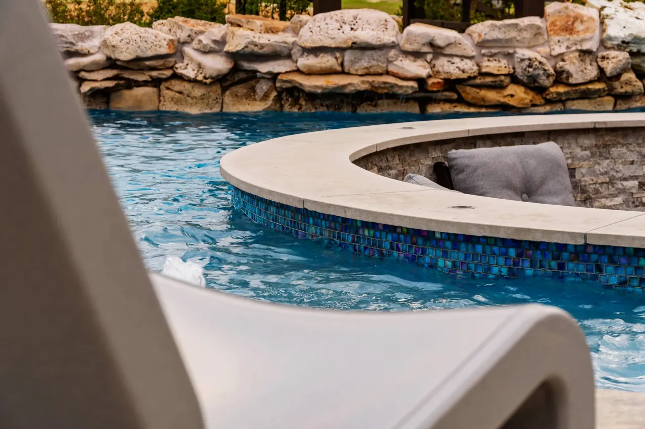 Farmhouse Lagoon — Freeform pool with sunken lounge in Travis County, TX by GB IV Designs (photo 8)