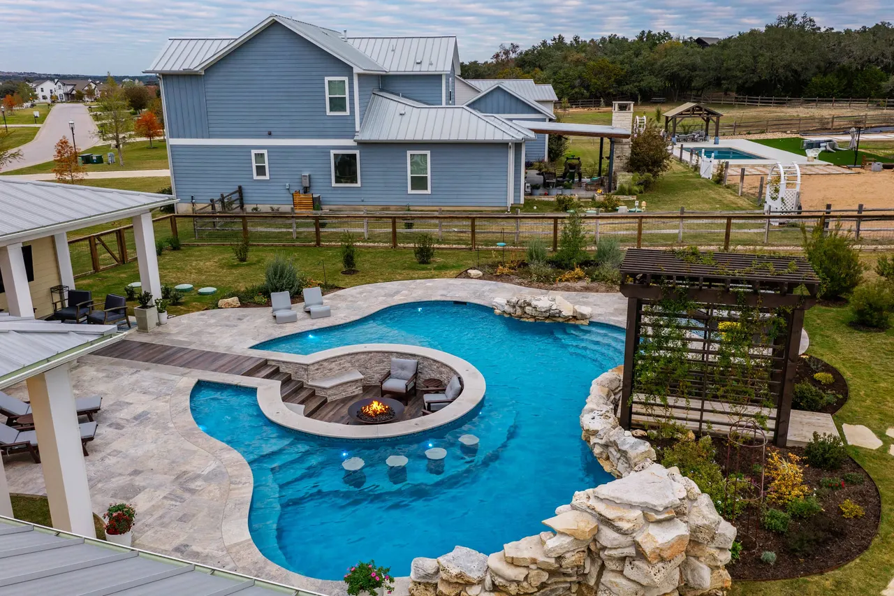 Farmhouse Lagoon — Freeform pool with sunken lounge in Travis County, TX by GB IV Designs (photo 15)