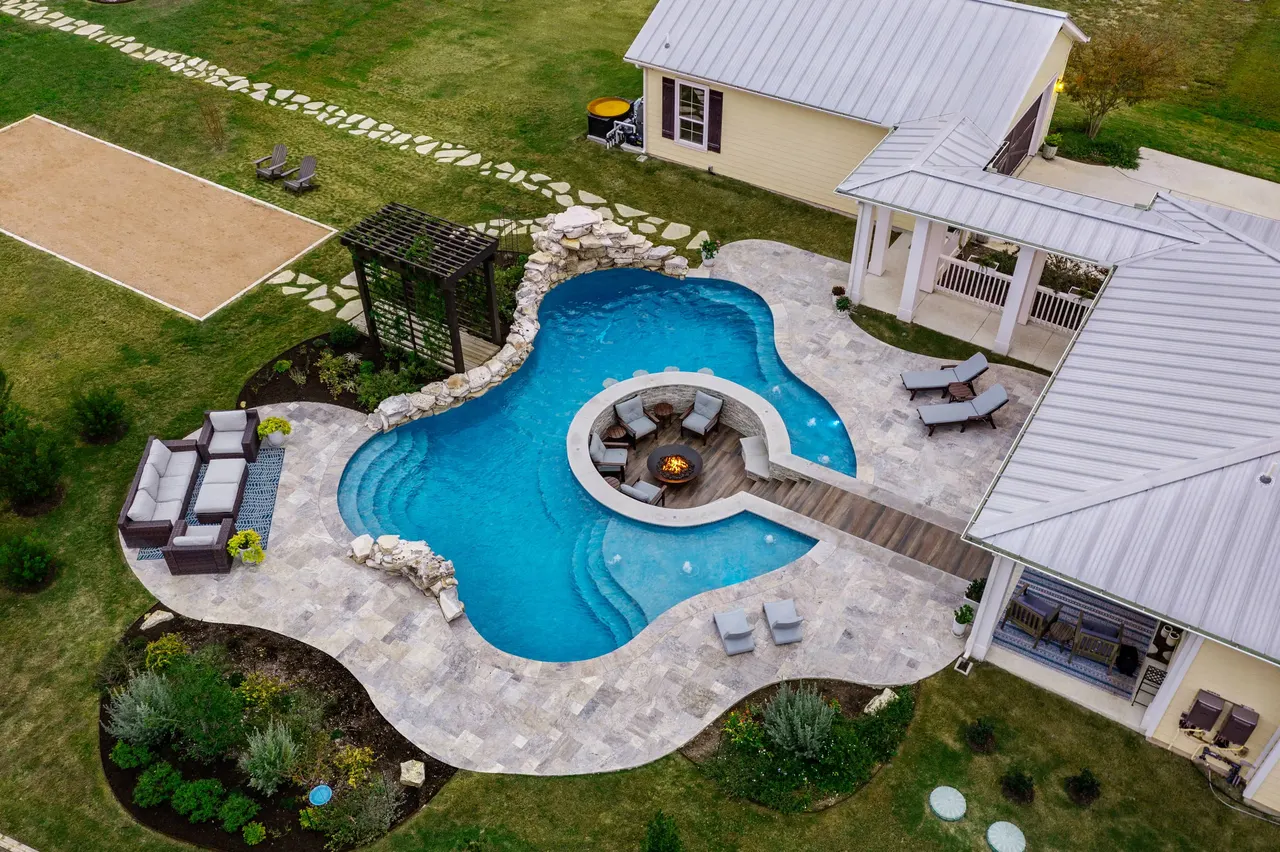 Farmhouse Lagoon — Freeform pool with sunken lounge in Travis County, TX by GB IV Designs (photo 17)