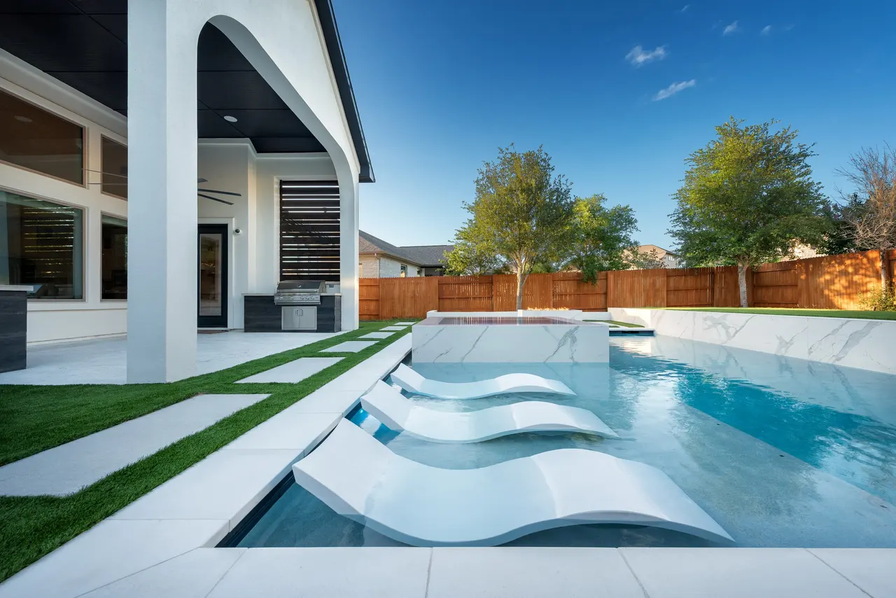 Marble Courtyard — Compact modern pool in Dripping Springs, TX by GB IV Designs (photo 5)