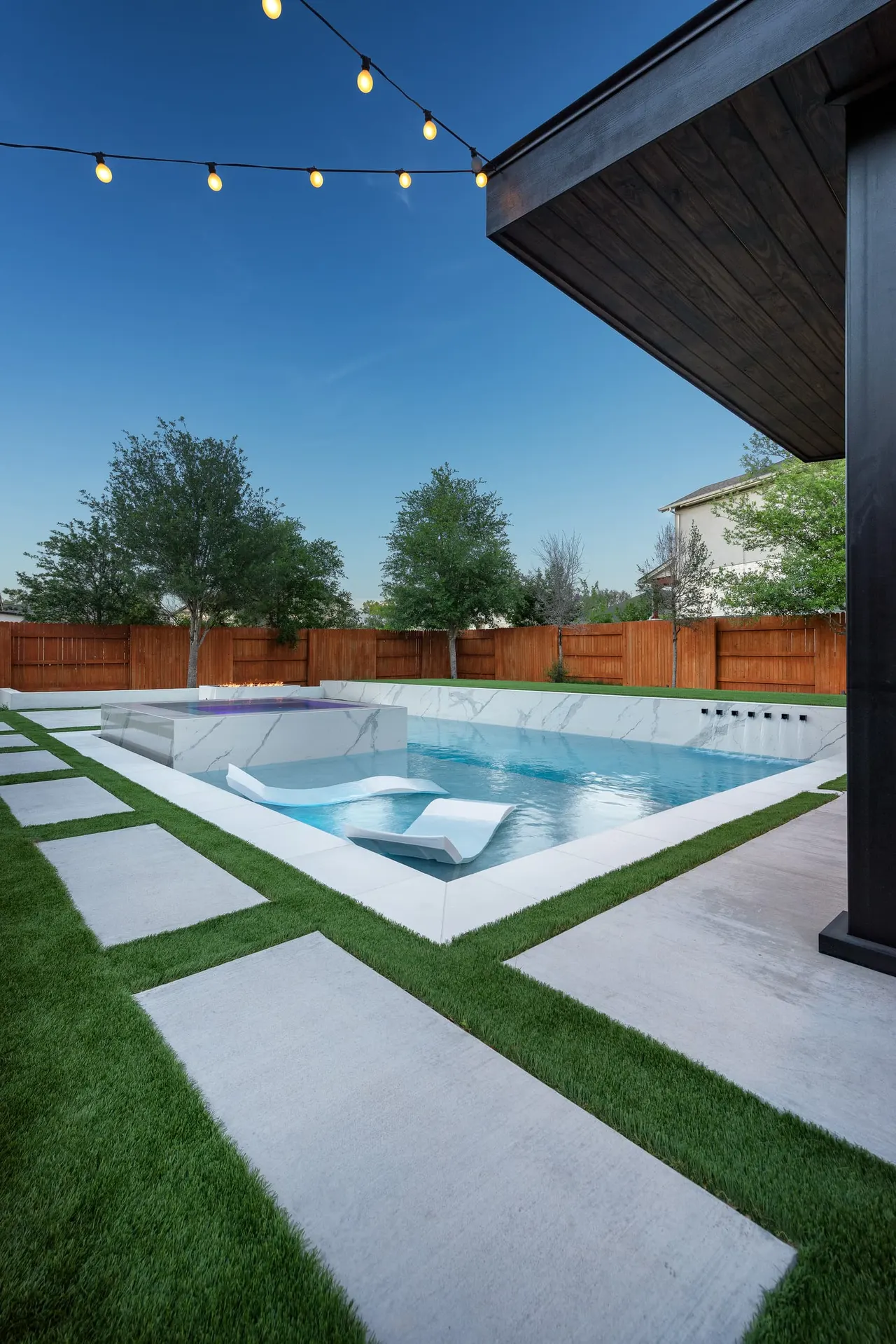 Marble Courtyard — Compact modern pool in Dripping Springs, TX by GB IV Designs (photo 14)