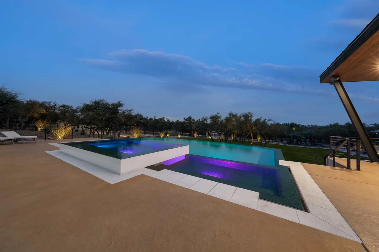Ranch Modern — Geometric pool with slot overflow in West Lake Hills, TX by GB IV Designs