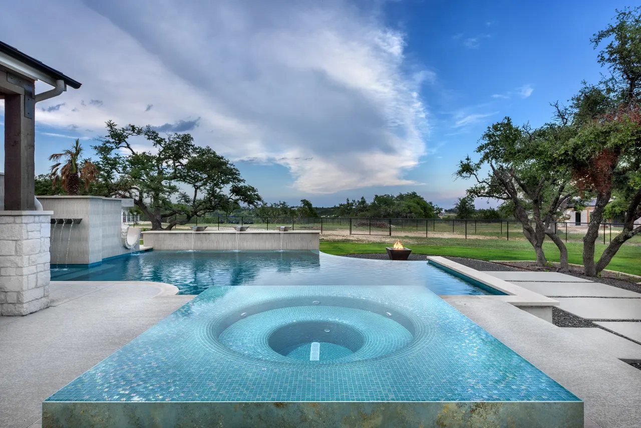 Sculpted Water Walls — Contemporary pool with water features in Bee Cave, TX by GB IV Designs (photo 7)